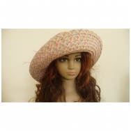 Woman hat from paper with knitted flower